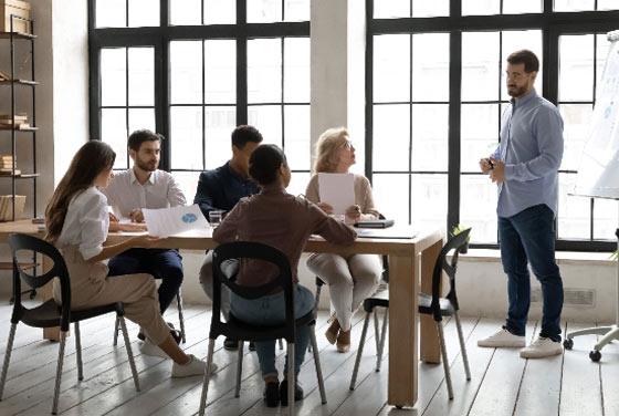 Employer discussing education advantages with prospective students